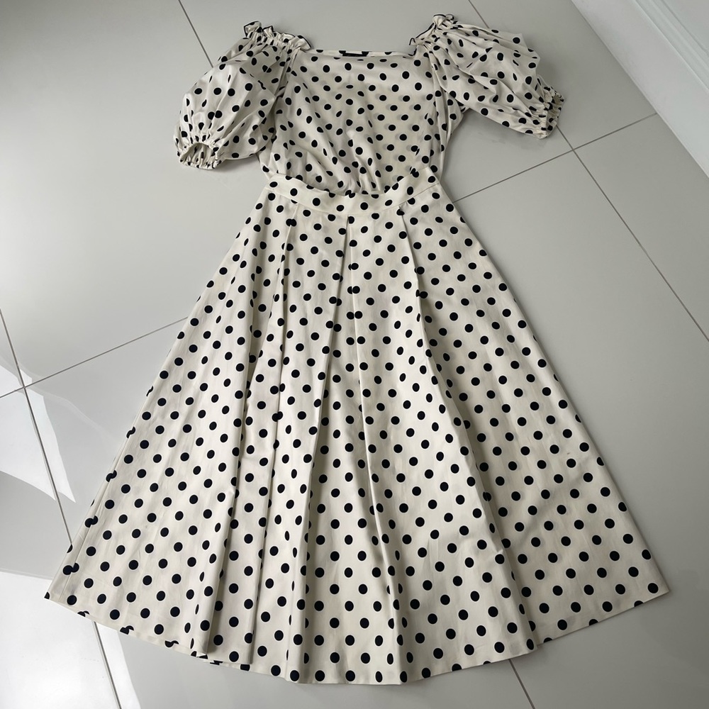 Set of:    Off the shoulder polka dot top (size L ) and skirt (size 44 )